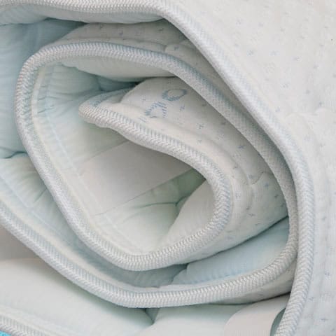 Close up of Premium quilted ship rack mattress topper for Navy and Coast Guard racks — from Rack Mat